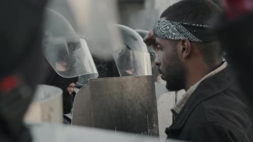 Adults with Shields Protesting in the City