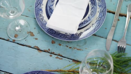 Elegant Table Setting with Dinnerware and Decorations