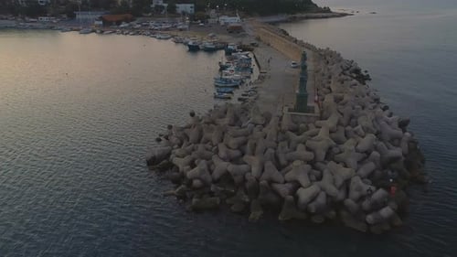 Anchored Fisherman Boats on The Quay with Lighthouse
