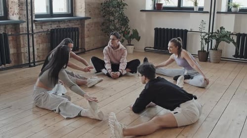 Students Stretching in Dance Studio