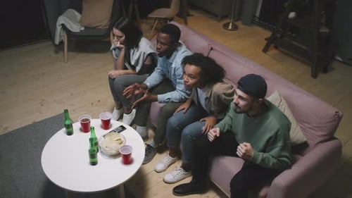 Friends Watching Sports and Celebrating Together