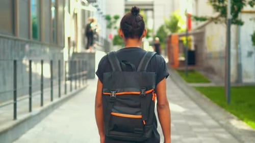 Back View Hipster Guy Walking in Urban City
