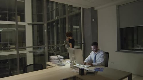 Colleagues Working Overtime