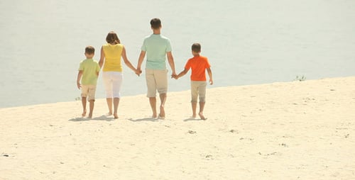 Family Walking on Beach Together, Holding Hands