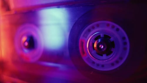 Revolving Cassette Tape in Blue and Purple Light