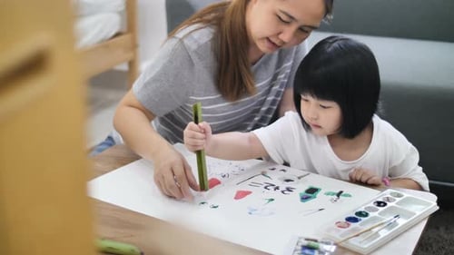 Woman and Child Painting at Home