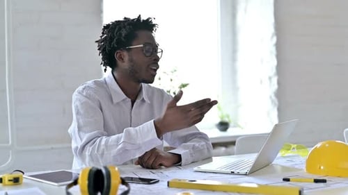 Young Adult Video Conferencing at Workplace