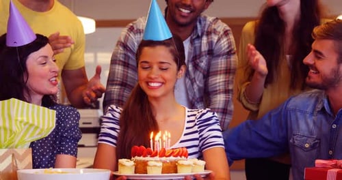 Friends Celebrate Birthday With Cake and Gifts