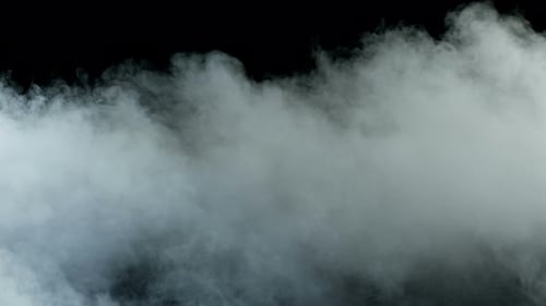 Drifting White Smoke Against Black Background