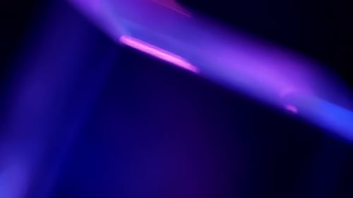 Lights Glare and Rays in Pink, Purple and Blue Abstract. Natural Crystal Light