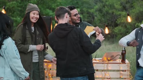 Group of Friends Dancing at Outdoor Party