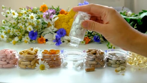 Colorful Pills and Vitamins with Flowers