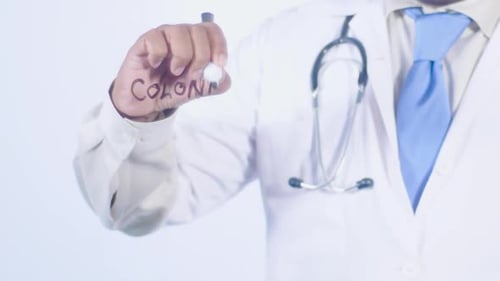 Doctor Writes Colonic Term on Clear Surface