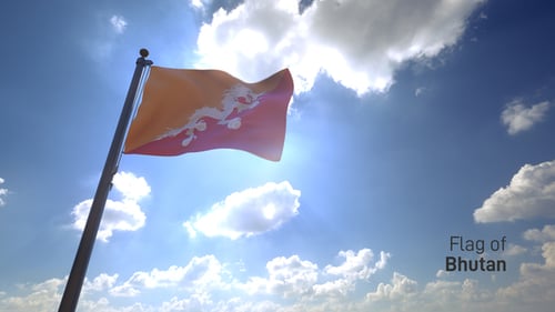 Bhutan Flag Waving Against Blue Sky with Sunlight