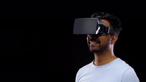 Young Adult Using VR Headset on Black Background