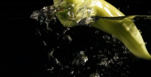 Green Peppers In Water Slow Motion