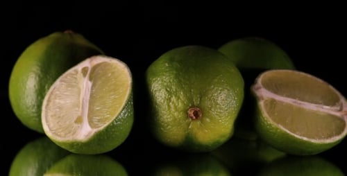 Close Up of Fresh Limes on Black Background