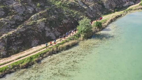 Group Of People Trekking By The Lake On Aerial View 2