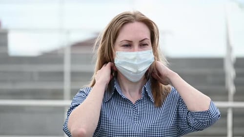Portrait of a Masked Girl in the Street. Protection of Breathing From Covid-19 Viruses. Pandemic in