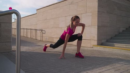 Physical Activity for Good Body Shape and Health Young Woman is Training Alone Outdoors in City