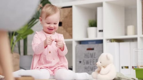 Eco Wood Toy Baby Game Little Clever Caucasian Child Playing Natural Toys on Floor at Home