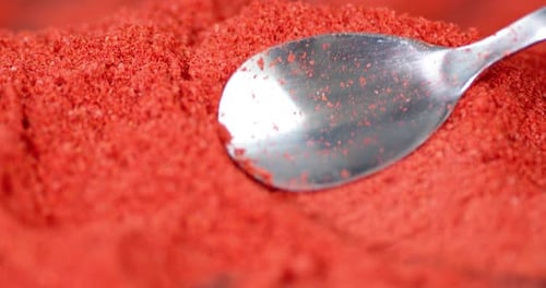 With a Spoon Mix the Ground Red Pepper of Chili.