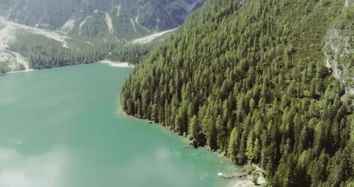 Aerial Drone Flight Establisher Over Lake with Clouds and Forest