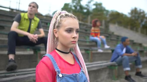 Young Adults Hanging Out on Stadium Bleachers