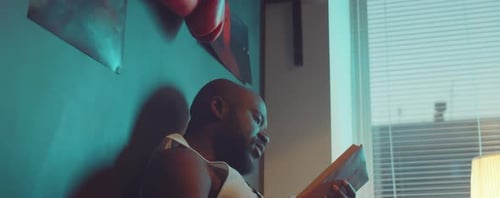Man Relaxing at Home Reading Book