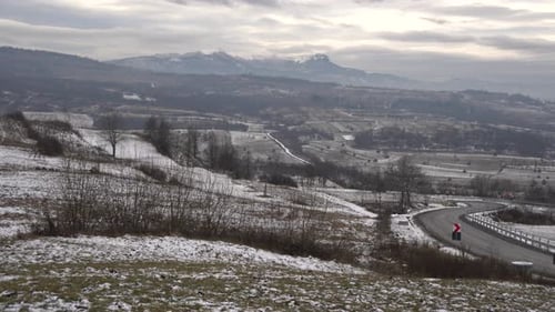 Pan of road and hills