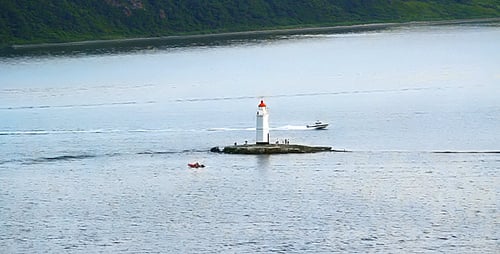 Scenic Lighthouse on a Small Island in Ocean