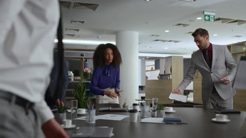 Multiracial Office Team Discuss Corporate Data on Business Conference Meeting