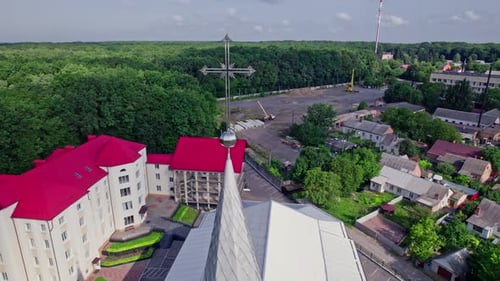 Church With Cross in Urban Environment Aerial View