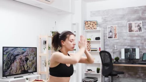 Woman Does Yoga in Her Living Room