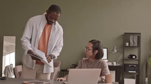 Two Diverse Men Coworking in Office