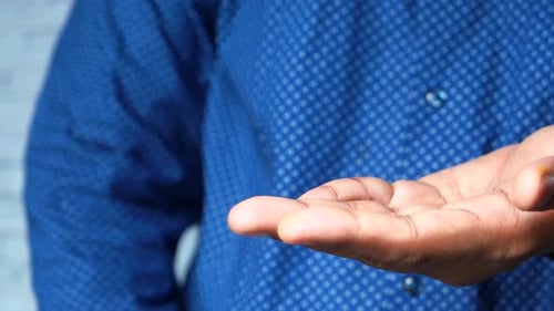 Close Up of Young Man Hand Using Hand Sanitizer Spray.