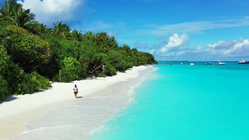 Pretty smiling girl on vacation spending quality time at the beach on paradise white sand and blue 4