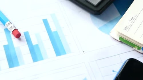 Financial Graph Calculator and Notepad on Table