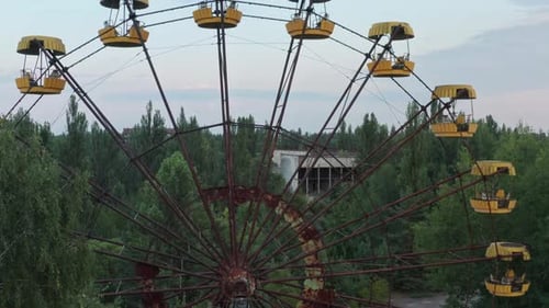 Abandoned Ferris Wheel in Decayed City Aerial View