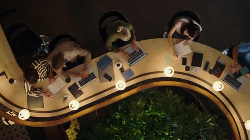 Creative People Finishing Work in Office