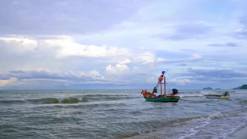 A small fishing boat anchored in the sea.