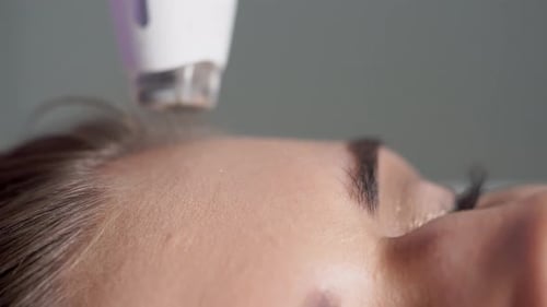 Woman Receives Cosmetic Forehead Treatment Close Up