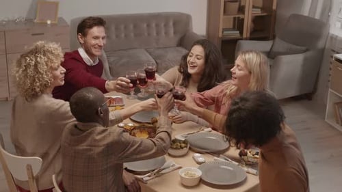 Friends Gather Together for Festive Meal and Toast