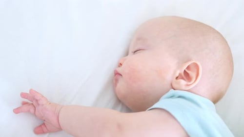 Cute Infant Sleeping Peacefully in Close-Up Shot