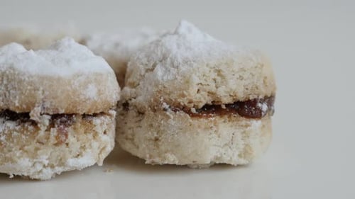 Close-up of little vanilla dessert stuffed with jam slow tilt 4K 2160p 30fps UltraHD footage - Serbi