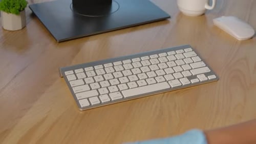 Hands in Protective Latex Gloves Sprays an Antiseptic on the Keyboard Surface and Thoroughly Cleanse