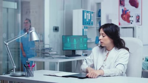 Doctor Explaining Medical Information in Office