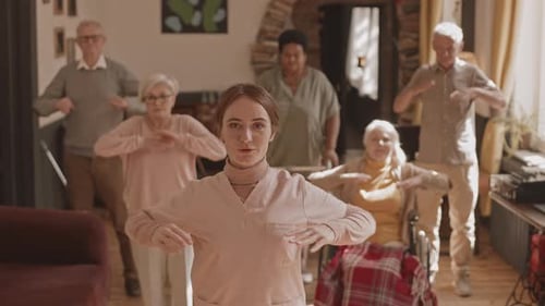 POV of Nurse and Seniors Doing Exercises in Nursing Home