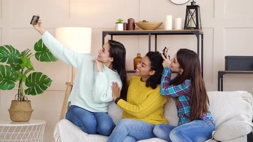 Three Young Women Taking a Selfie at Home