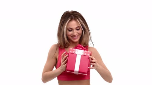 Woman Offers Gift, Smiles on White Background